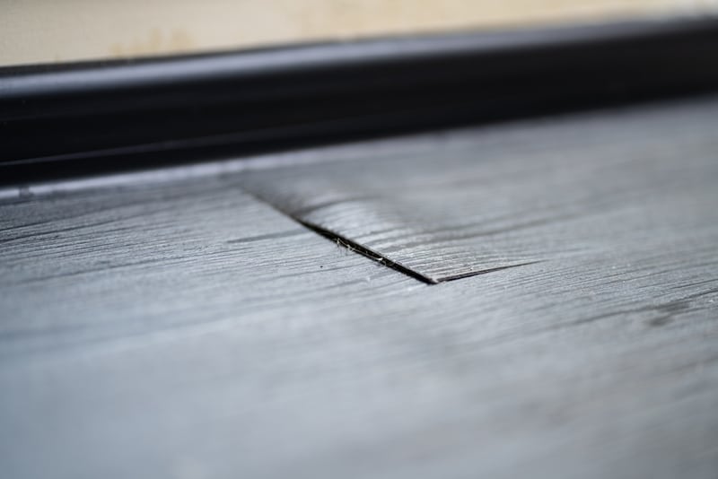 Warped vinyl floor from water damage