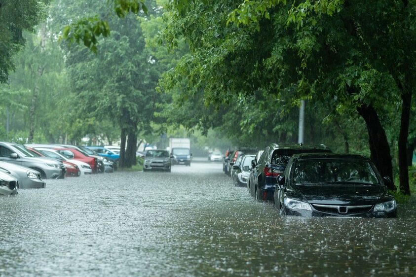 Flooded,Cars,On,The,Street,Of,The,City.,Street,After flood watch